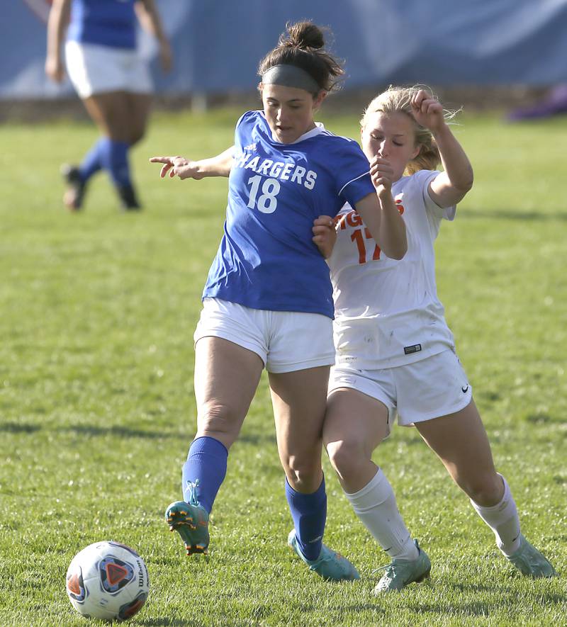 Crystal Lake Central's Kaitlin Gaunaurd takes a shot on goal in front of Dundee-Crown's Margarita Hernandez during a Fox Valley Conference soccer match Tuesday April 26, 2022, between Crystal Lake Central and Dundee-Crown at Dundee-Crown High School.