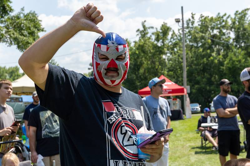 Kyle Cardinals boo's wrestlers at the Taste of the Illinois Valley DreamWave Wrestling event on Saturday, August 2, 2025 at Centennial Park in Peru.