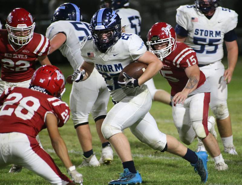 Bureau Valley's Elijah Endress runs the ball between Hall defenders Jack Curran, Deanthony Weatherspoon and Tristan Redcliff on Friday, Sept 8, 2023 at Richard Nesti Stadium.