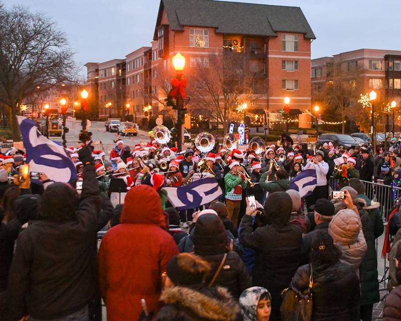 Members of the Downers Grove South marching band preform during the Christmas tree ceremony on Friday Nov. 29, 2024, held in downtown Downers Grove.