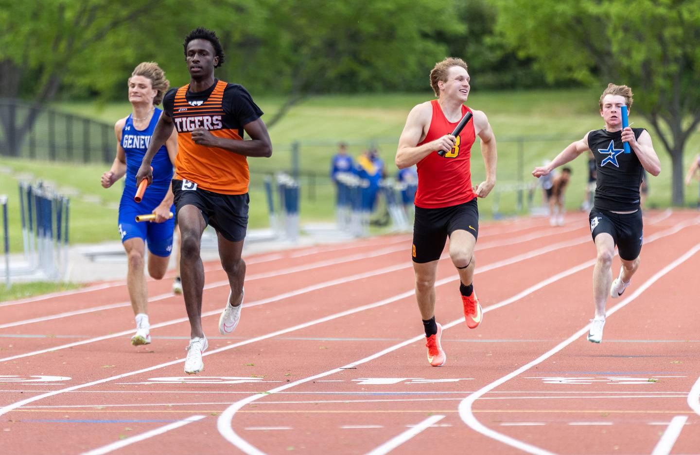 Wheaton Warrenville South’s Amari Williams leads and wins the varsity 4x100 meter race during the Dukane Conference Boys Track and Field Meet hosted by Lake Park High School in Roselle on Friday, May 16, 2025.