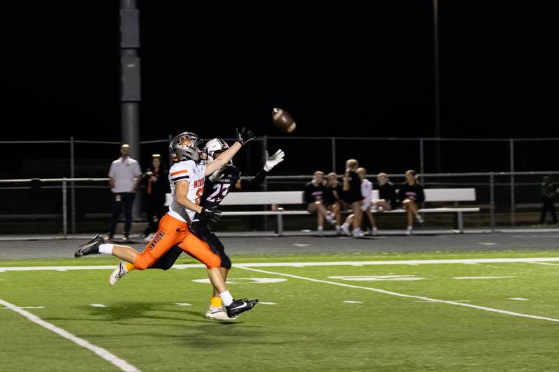 Brady Hairald (Minooka) and Mariell Macon (Plainfield North) race for the ball during the Oct. 11 game held at Plainfield North.