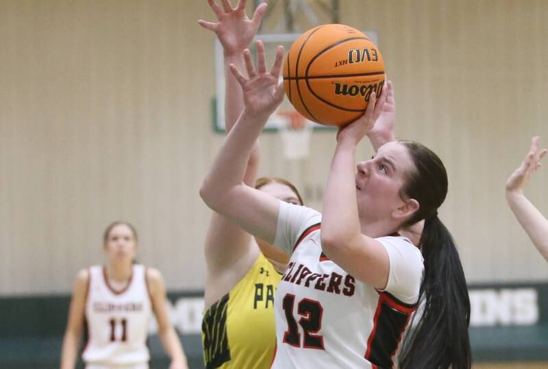 Amboy/Ohio's Addison Pertell eyes the hoop while making her way into the lane past Putnam County's Maggie Spratt during the Class 1A Regional semifinal game on Tuesday, Feb. 18, 2025 at St. Bede Academy.