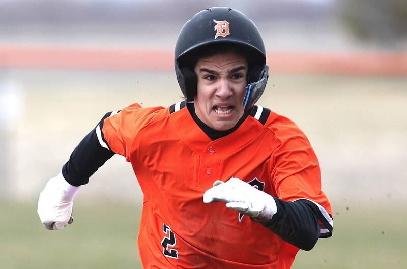 DeKalb's Nathaniel Nunez hustles to third after tagging up on a fly ball during their game against Jefferson Wednesday, April 6, 2022, at DeKalb High School.