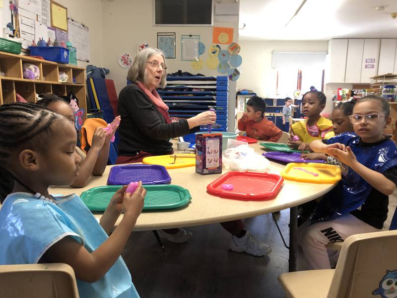 Michelle Lincicome-Hayes works with children Thursday, March 20, 2025, in Elgin's Two Rivers Head Start program. It is one of three locations operated in Kane and DeKalb counties.