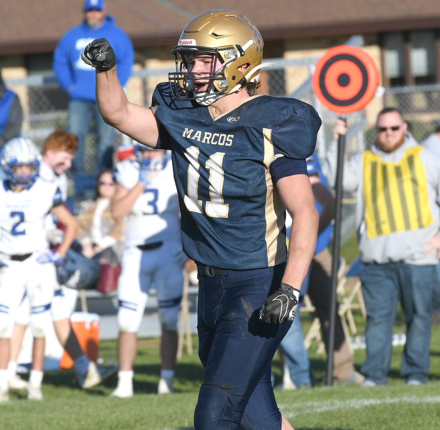 Polo's Wyatt Queckboerner celebrates the Marcos' win over Milford Cissna Park during 8-man playoff action on Saturday.