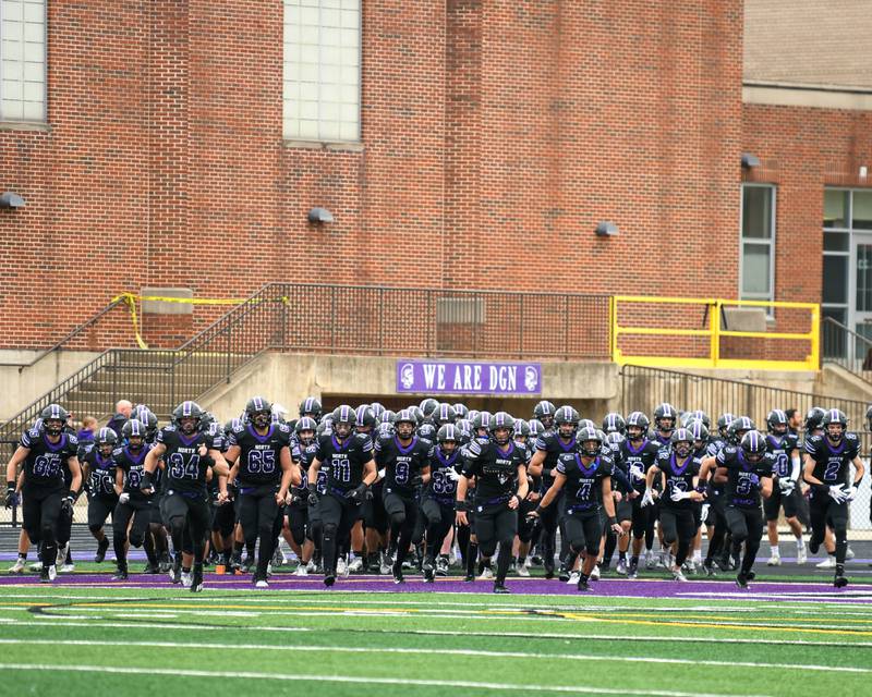 Downers Grove North’s football team takes the field before the start of the second week of the class 3A game on Saturday Nov. 9, 2024, while taking on Fenwick High School held at Downers Grove North High School.