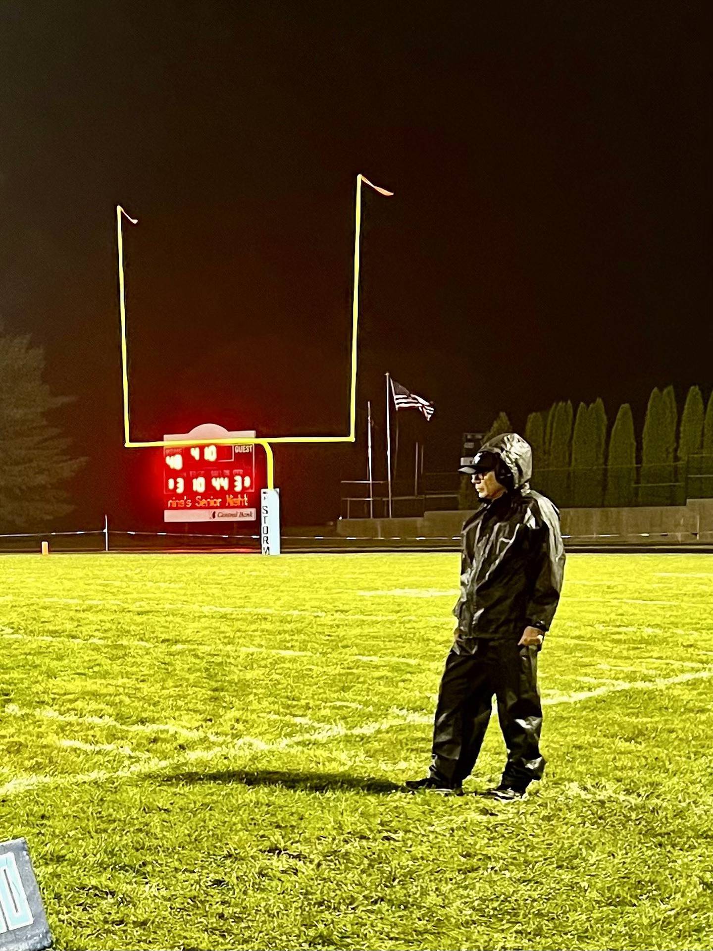 Longtime Storm assistant coach Craig Johnson bundles up on a night fit for a storm. Coach J was recognized Friday in his probable last home game for his years of commitment to the Storm program. He is retiring this year.