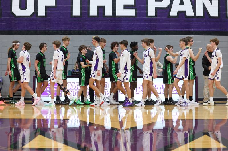 Manteno and Bishop McNamara players shake hands following their game on Tuesday, Jan. 13, 2026, during which they hosted Safe Harbor Night to collect donations to benefit Harbor House.