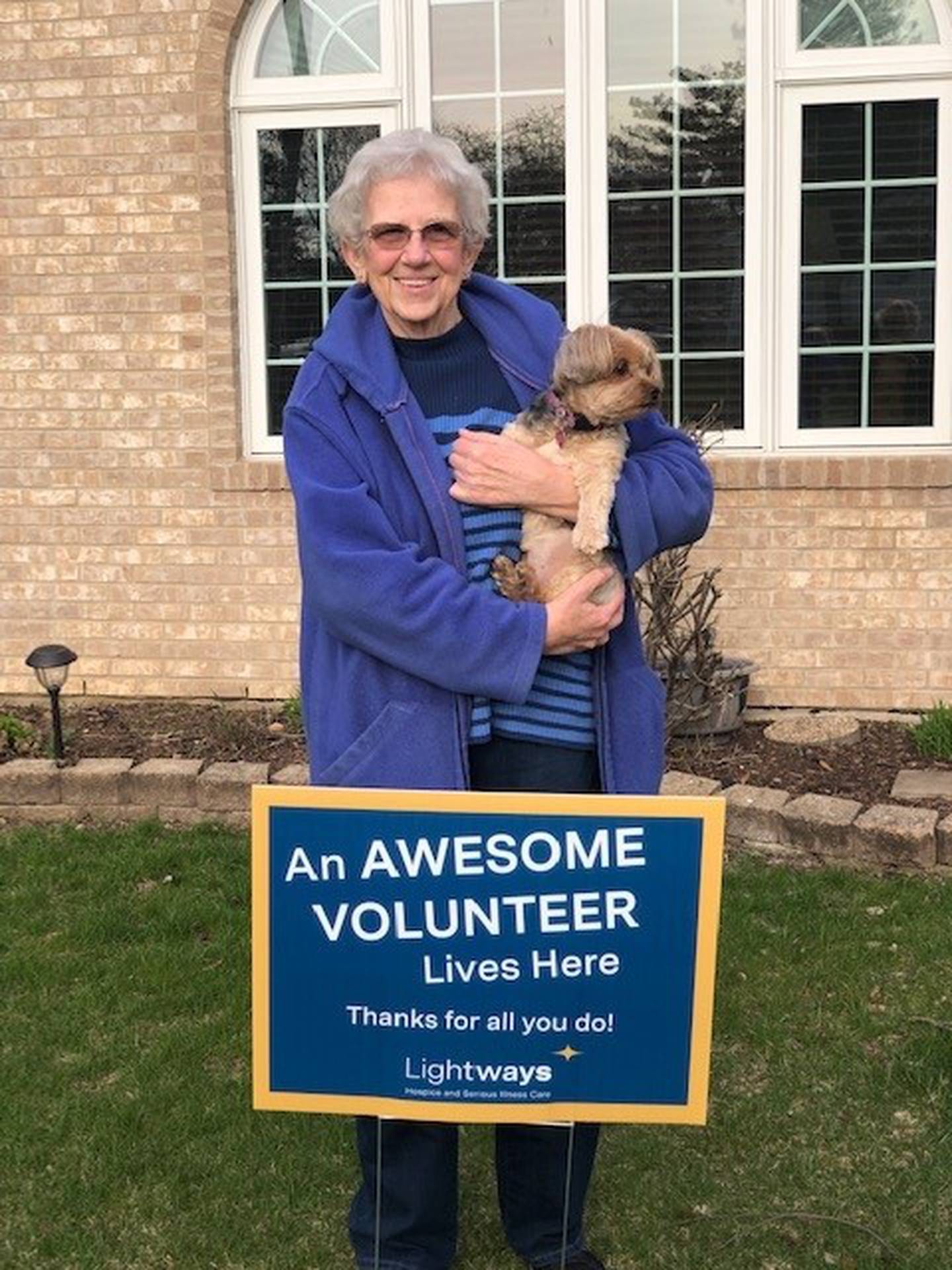 Last week Lightways Hospice and Serious Illness Care in Joliet honored its 120 volunteers by placing signs in the volunteers yards for National Volunteer Appreciation Week 2022. Pictured is Jean Eichholzer.