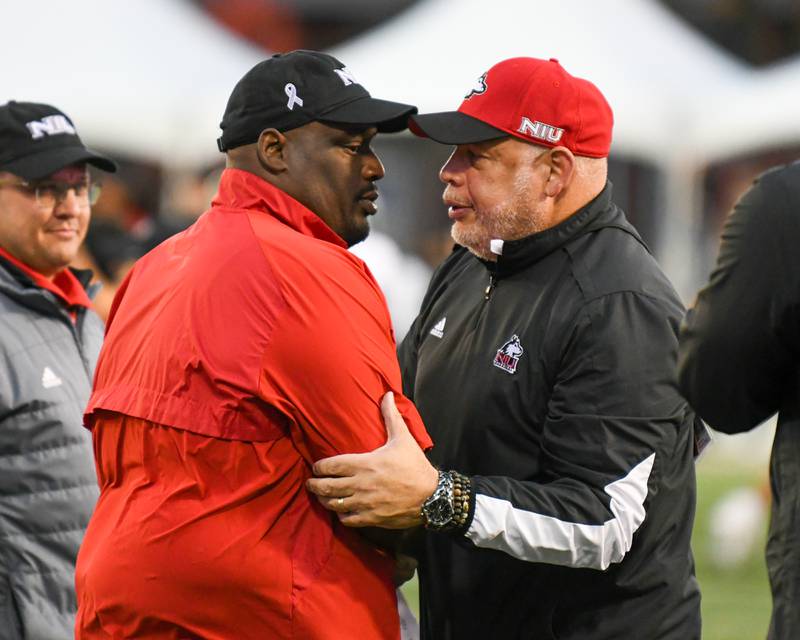 NIU’s Vice President and Director of athletics and Recreation, right, hugs NIU head coach Thomas Hammock after taking the win over Eastern Michigan on Saturday Oct. 21, 2023, held at Huskie Stadium in DeKalb.