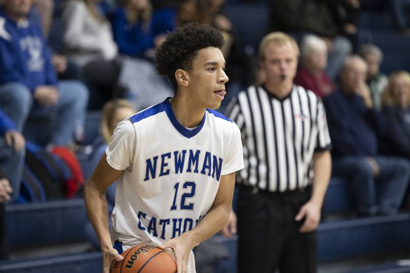 Newman’s Isaiah Williams works the ball Tuesday, Dec. 13, 2022 against Pecatonica.
