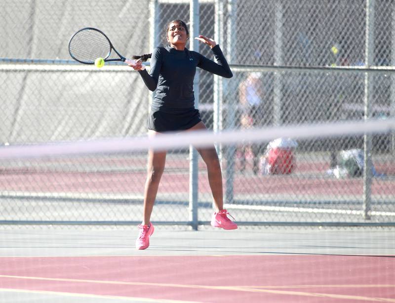Batavia’s Julia Arulandu returns the ball during a match against Havillan Dow of Mother McAuley on Thursday, Oct. 24, 2024 in the IHSA 2A singles tennis championship at Schaumburg High School.