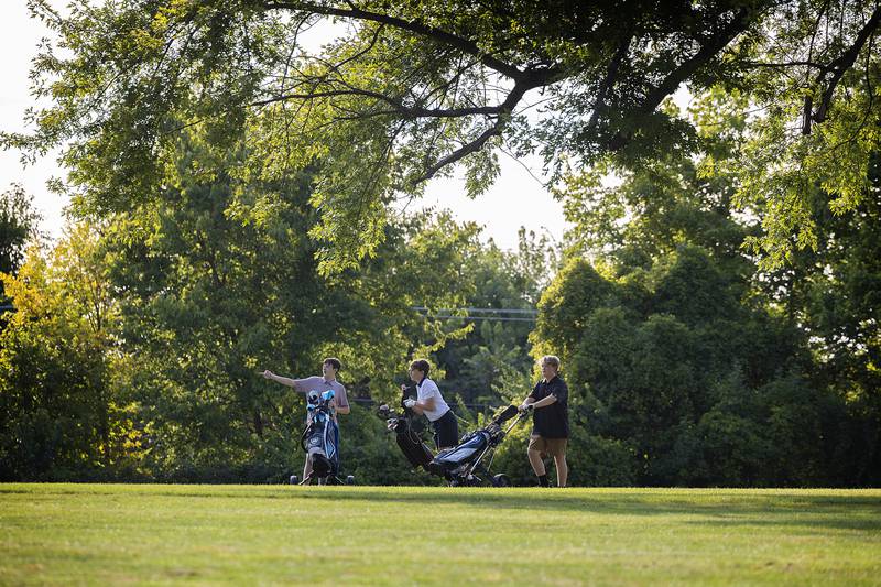 Ethan Kuhn (left), 13, Owen Breitzka, 13, and Malyx Plock, 14, head for green number two Wednesday, Sept. 10, 2025, in Dixon.