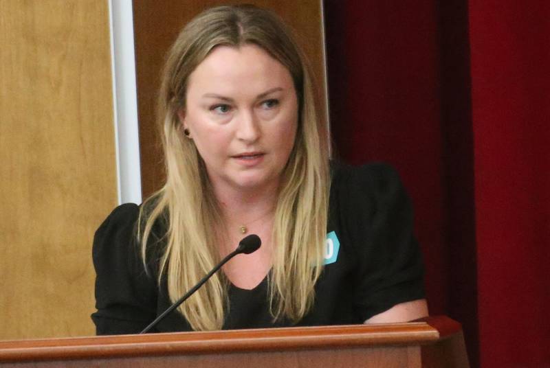 Coleen Burns speaks to the Illinois Health Facilities and Services Review Board during a public hearing regarding OSF St. Elizabeth Hospital's plans to reduce services on Tuesday, June 10, at Central Intermediate School in Ottawa.