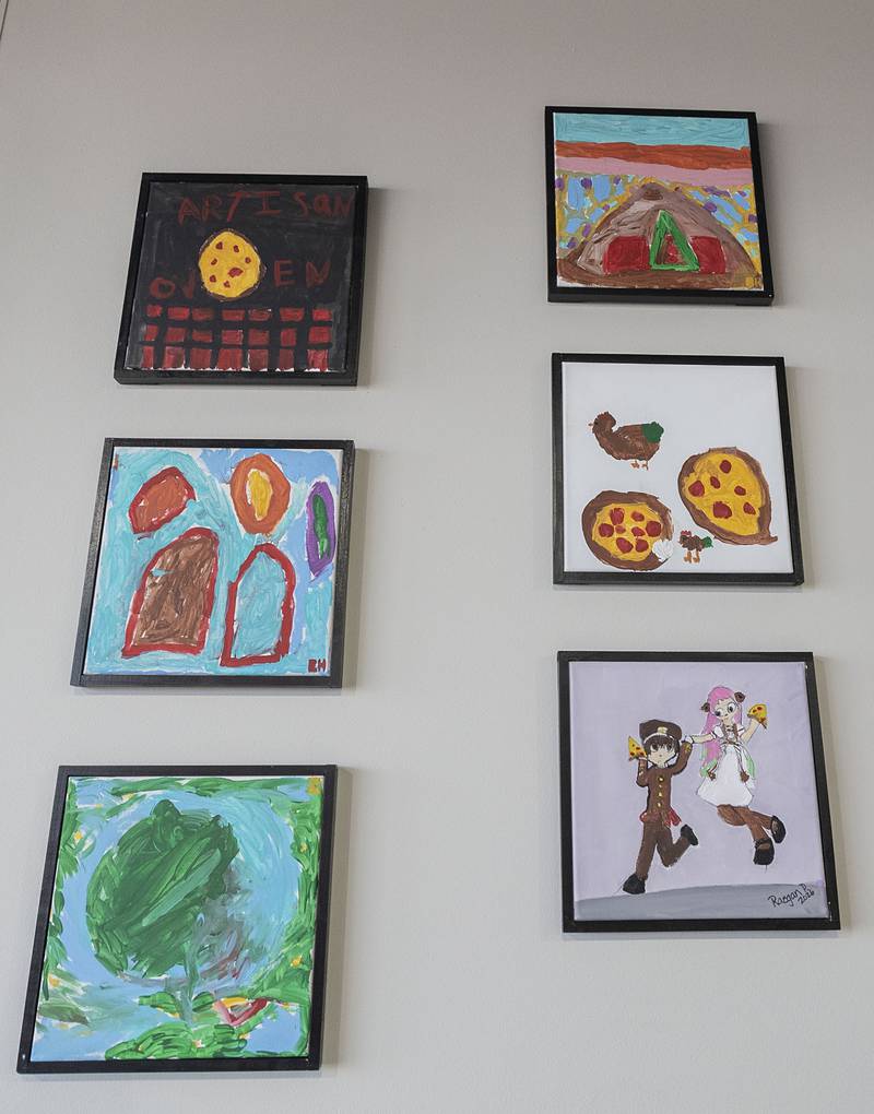 Artwork on the walls of Artisan Oven was created by the owner’s grandchildren.