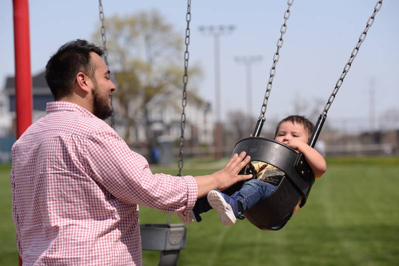 Families including Jesus Silva of Cicero and his son Luca  enjoy the weather at Sedgwick Park Sunday, April 14, 2024.