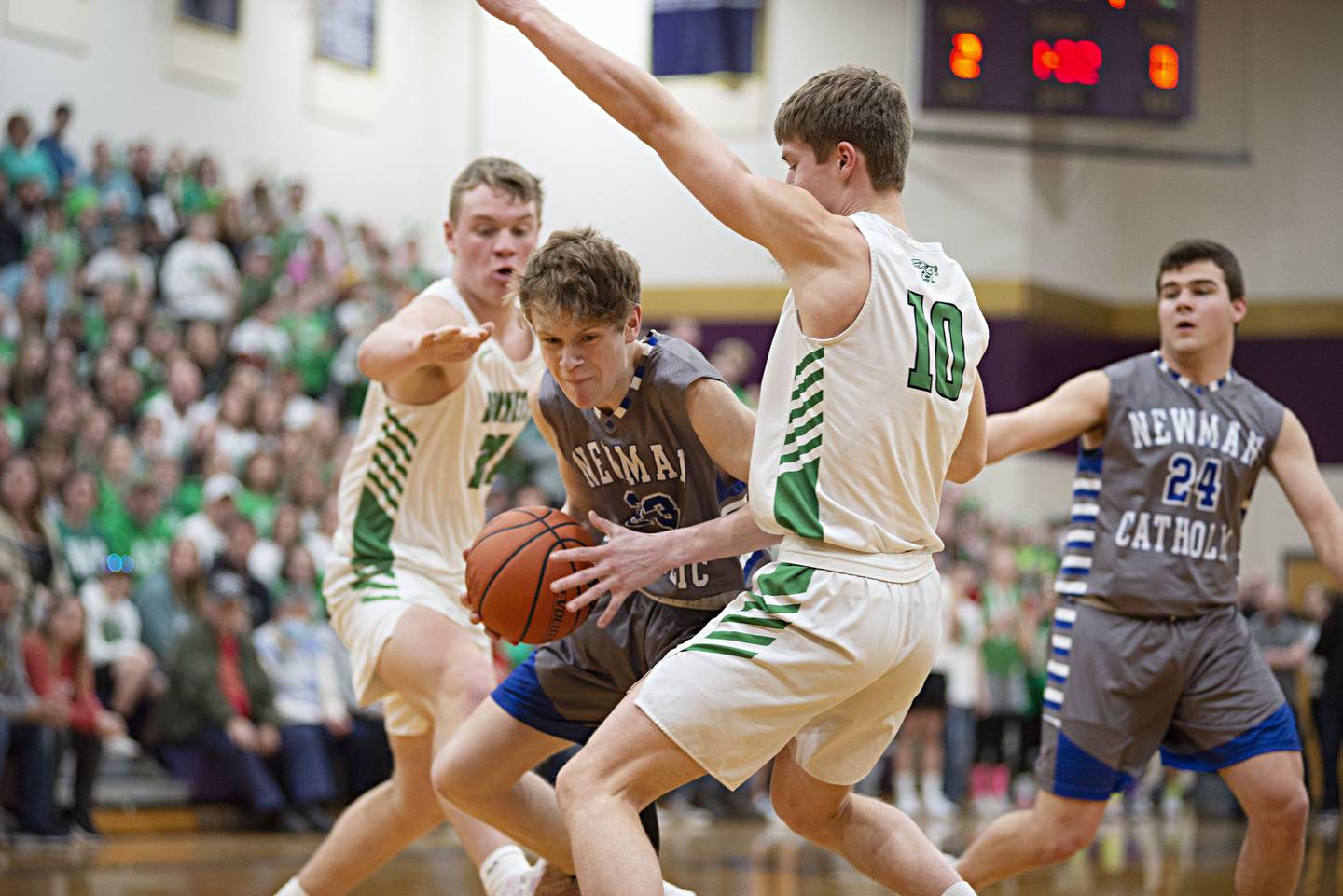 Newman's Lucas Simpson works below the basket against Scales Mound in the sectional final Friday, March 4, 2022.