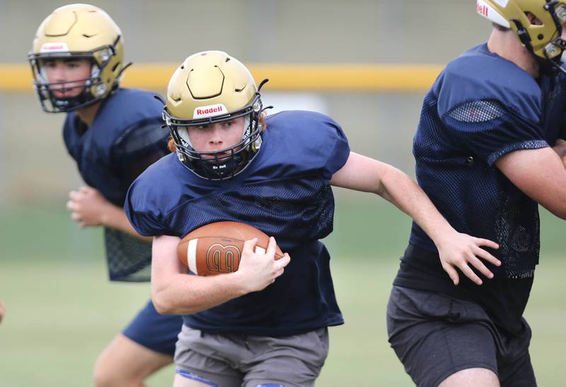 A Hiawatha running back carries the ball during practice Wednesday, August 9, 2023, at the school in Kirkland.
