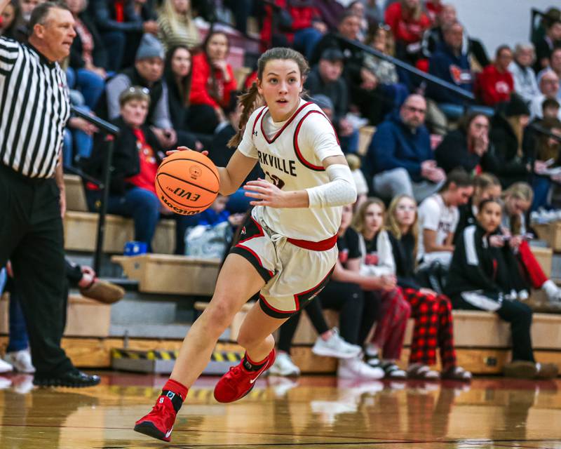 Yorkville's Lainey Gussman (12) drives to the basket during their basketball game between Oswego East at Yorkville, Thursday  Dec 12, 2024 in Yorkville.