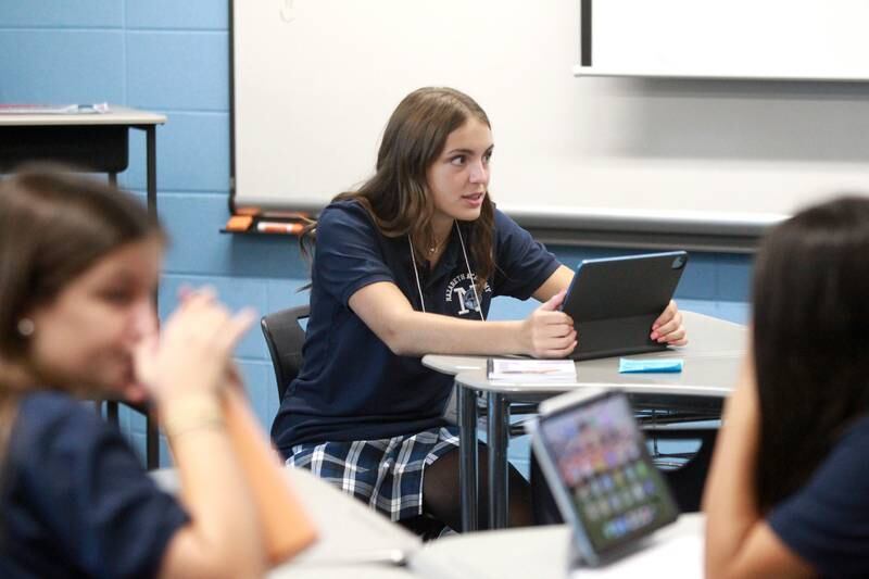 Nazareth Academy incoming freshman Ella Piwnicki sits in her homeroom class at the La Grange Park school on Friday, Aug. 16, 2024 as part of Freshman Orientation.