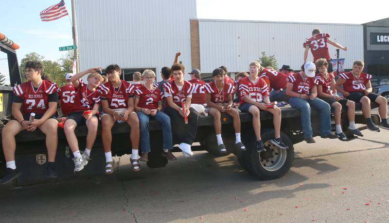 The Hall High School football team rides during the Homecoming parade on Thursday, Sept. 18, 2025 downtown Spring Valley.