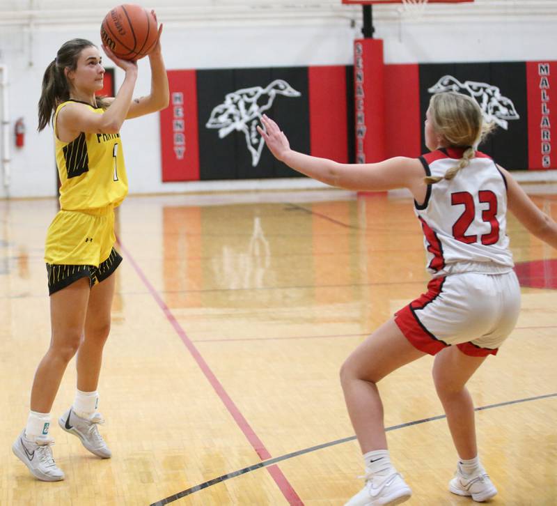Putnam County's Ava Hatton sinks a three-point basket over Henry-Senachwine's Grace Anderson on Monday, Dec. 18, 2023 in Henry.