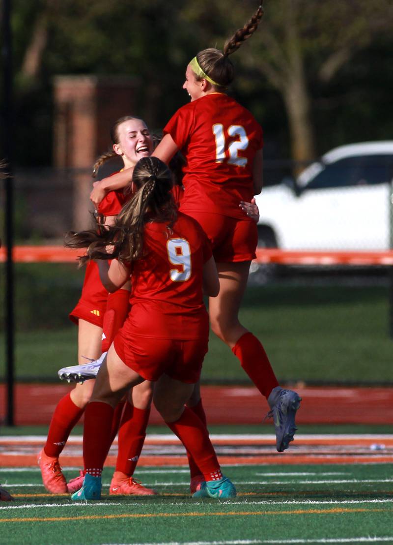 Batavia's Emma Wecker (center) celebrates a goal with teammates Alexa Schorr and Payton Haslett during a Tri-Cities Soccer Night game against Geneva on Tuesday, April 29, 2025 at St. Charles East.