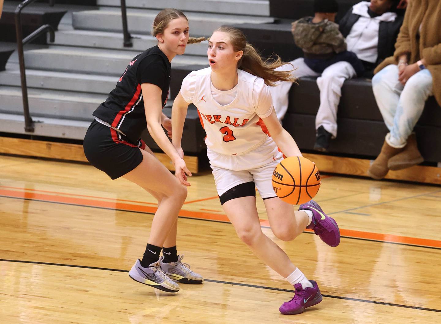 DeKalb's Olivia Schermerhorn drives by Rockford East's Aubrey Phillip during their game Wednesday, Jan. 22, 2025, at DeKalb High School.