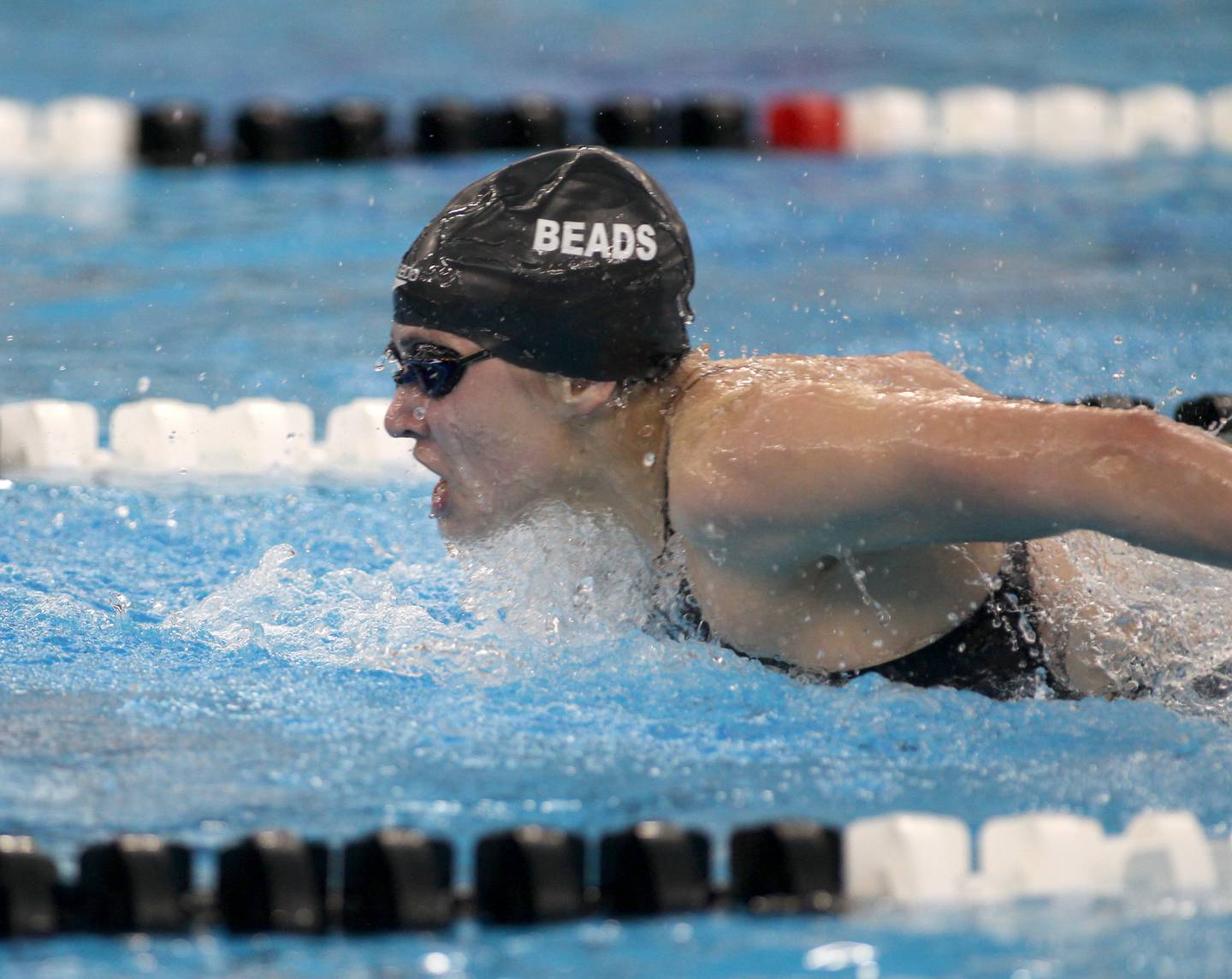 Rosary’s Becky Rentz competes in the 100-yard butterfly during the IHSA Girls State Championships preliminaries at the FMC Natatorium in Westmont on Friday, Nov. 11, 2022.