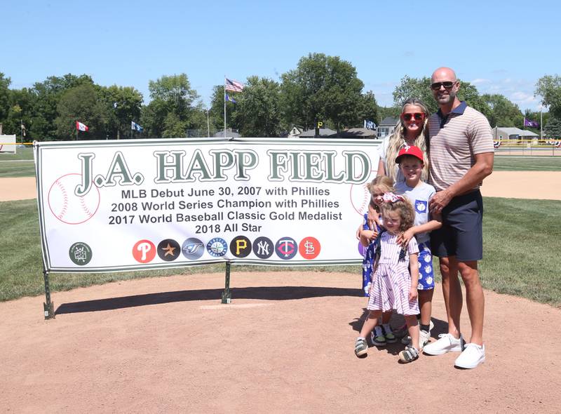 J.A. Happ and his wife Morgan, pose for a photo with their daughters Bella and Sloan, along with their son James "JJ" during the J.A. Happ Day and field dedication on Sunday, July 30, 2023 at Washington Park in Peru. The new field is renamed after native son and former big leaguer J.A. Happ.
