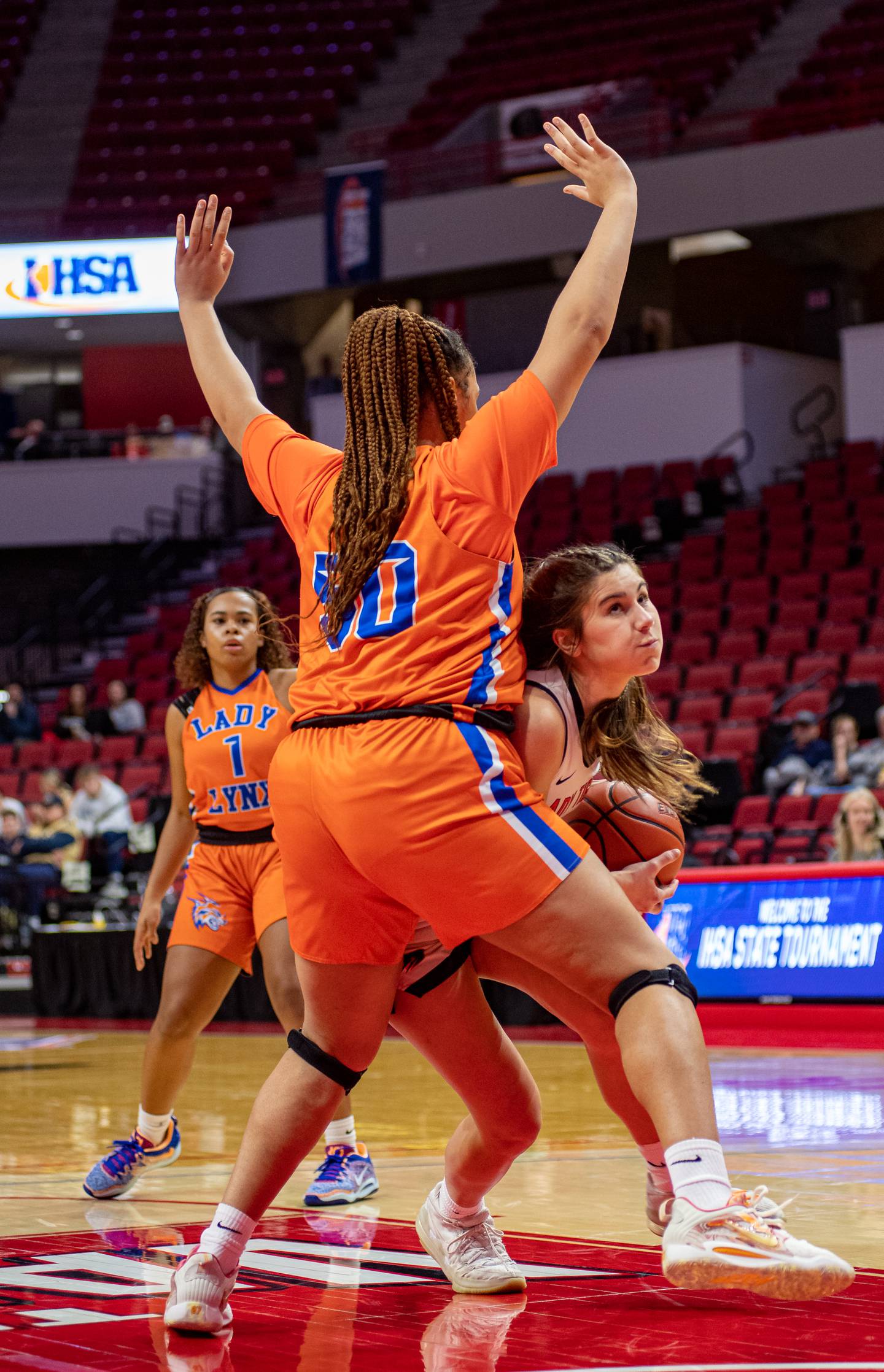 Byron's Ava Kultgen (22) drives to the basket past Chicago Butler's Lanyra Mcgill (50) during the 2A state semifinal on March 2..