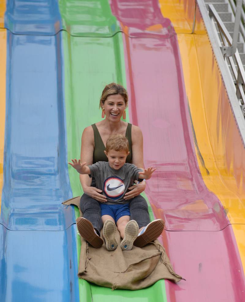 Tera and Miles Baetzel of Elmhurst enjoy the Slide during the Taste of Westmont Friday July  8, 2022.