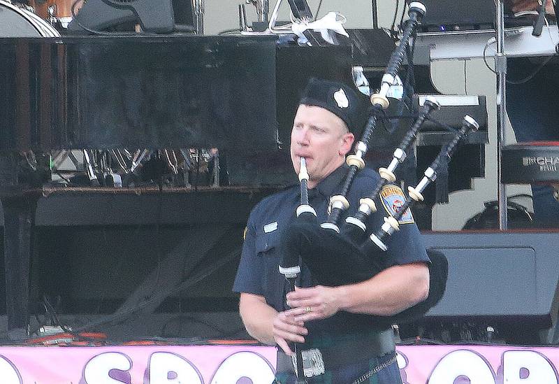 Princeton firefighter Nick Lavanway plays "America The Beautiful" before the Down on Main Street Summer Concert series on Friday, Aug.  8, 2025 in Princeton.