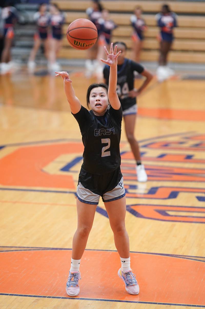 Oswego East's Anna Tran (2) shoots a free throw during a basketball game against Oswego at Oswego High School on Tuesday, Dec 12, 2023.