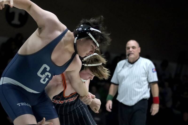 Crystal Lake Central’sTommy McNeil, far, battles Cary-Grove’s Aiden Senitz at 215 pounds in varsity wrestling Thursday, Dec. 19, 2024 at Cary-Grove High School in Cary.