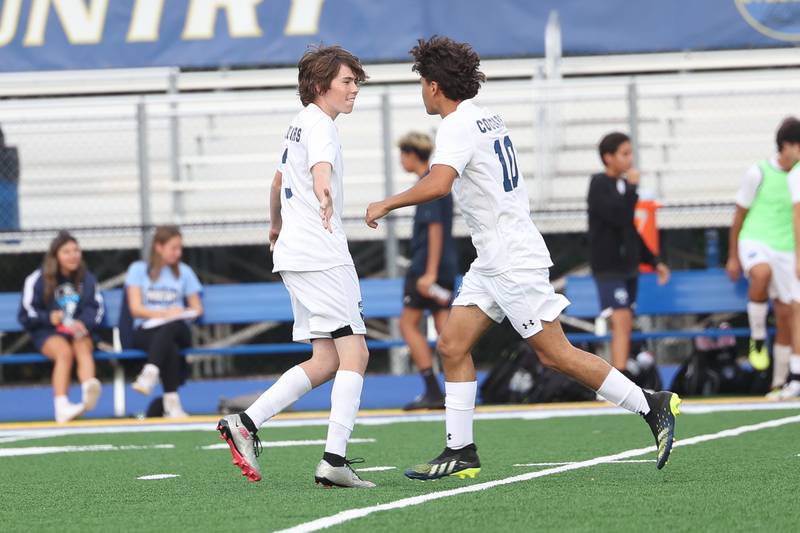 Plainfield South’s Christopher Verdin, 10, congratulates Jaimeson Power, 3, on his goal against Joliet Central on Tuesday, Sept. 5, 2023 in Joliet.