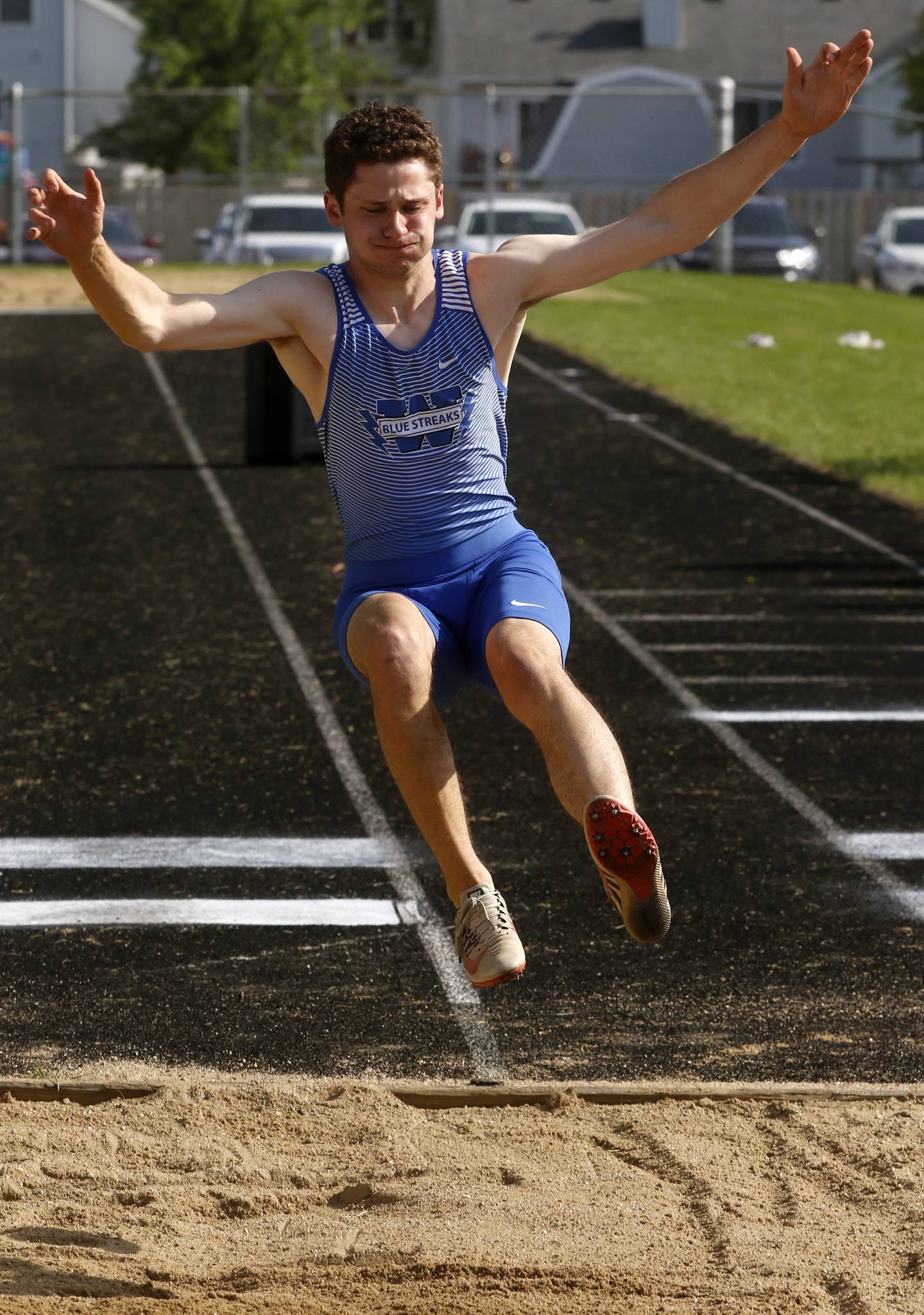 Woodstock’s Tim Maidment competes in the long jump during the IHSA Class 2A Belvidere Boys Track and Field Sectional Thursday, May 19, 2022, at Belvidere High School.