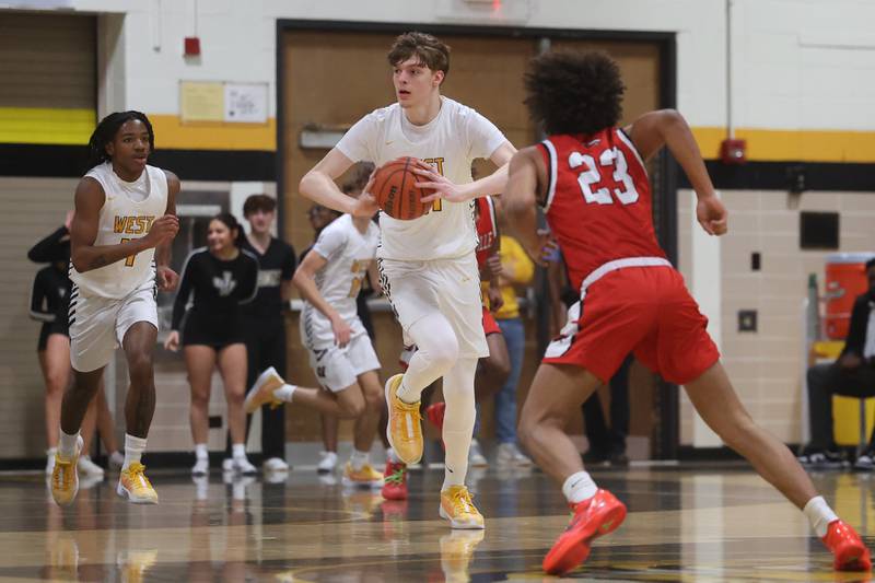 Joliet West’s Drew King looks to pass against Yorkville on Friday, Jan. 5th, 2024. in Joliet.