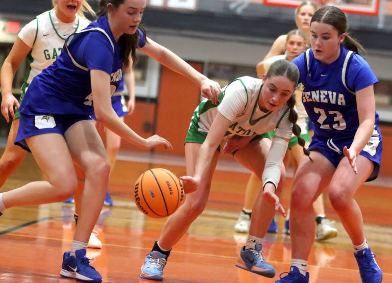 Crystal Lake South’s Tessa Melhuish, center, tries to get past Geneva’s Adelyn Estabrook, left, and Nora Hatton, right, in girls IHSA Class 3A Sectional Championship basketball on Thursday, Feb. 26, 2026, at Crystal Lake Central High School in Crystal Lake.