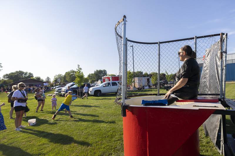 Jefferson School principal Crystal Thorpe awaits her fate in the dunk tank during Dixon PTO’s “Party in the Playground” Thursday, Aug. 29, 2024, at Wooden Wonderland.
