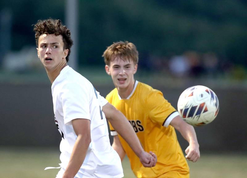 Jacobs’  Jackson Foley, right, and Prairie Ridge’s Carter Favia follow the ball in varsity soccer at Jacobs High School in Algonquin on Thursday, Sept. 18, 2025.