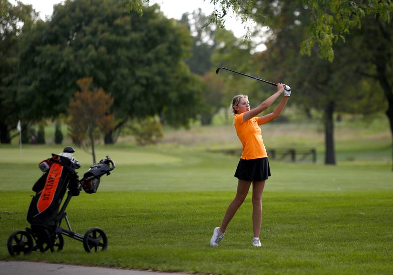St. Charles East’s Emily Geurts hits from the fairway during the Class 2A Waubonsie Valley Girls Golf Sectional on Monday, Oct. 6, 2025 at Springbrook Golf Course in Naperville.