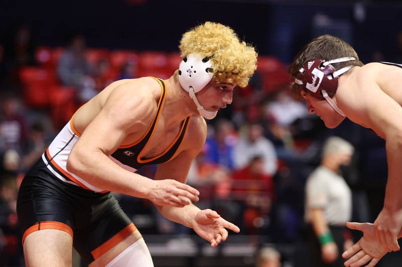 Sandwich’s Alex Alfaro works against Unity’s Grant Grant Albaugh in the Class 1A 182-pound semifinals at State Farm Center in Champaign on Friday, Feb. 18, 2022.