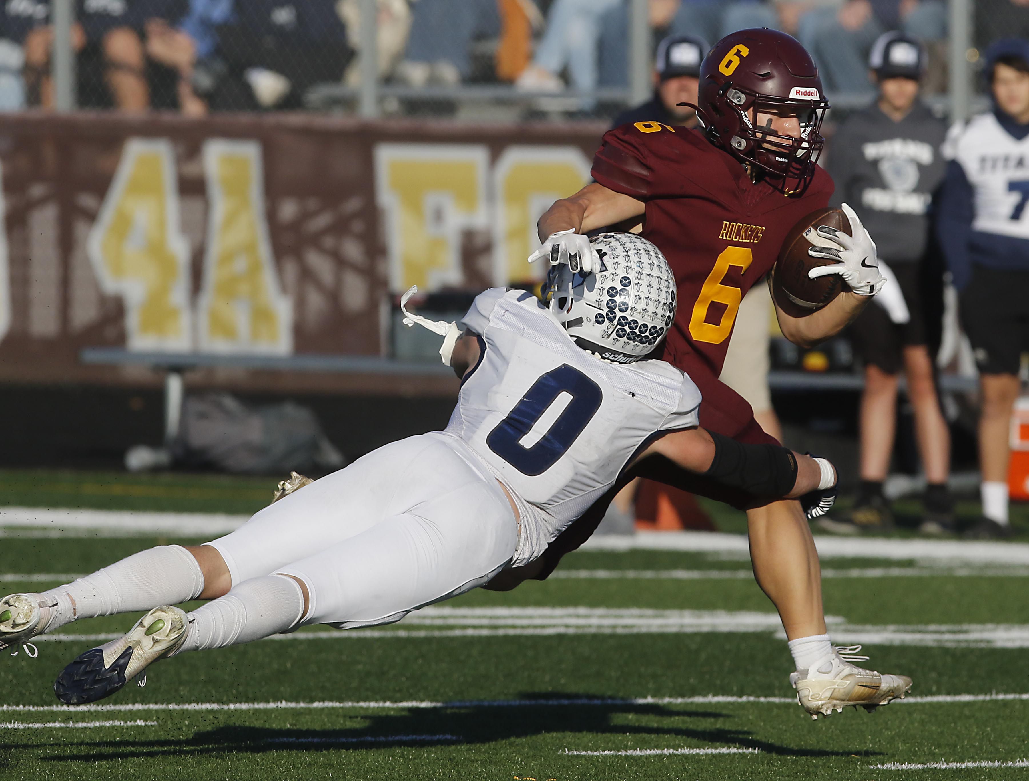 Monmouth-Roseville's Nick Huston tries to tackle Richmond-Burton's Hunter Carley during an IHSA Class 3A quarterfinal playoff football game on Saturday, November 15, 2025, at Richmond-Burton High School, in Richmond.