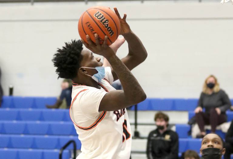 Shaw Local Jan. 17, 2022 file photo – DeKalb's Marlon King, shown here in 2022, shoots over a Wheaton North defender during a game in the Martin Luther King Jr. basketball tournament at Burlington Central High School in Hampshire. Marlon King Jr., a 2022 DeKalb High School graduate, was shot to death on May 11, 2023, at a DeKalb apartment complex.