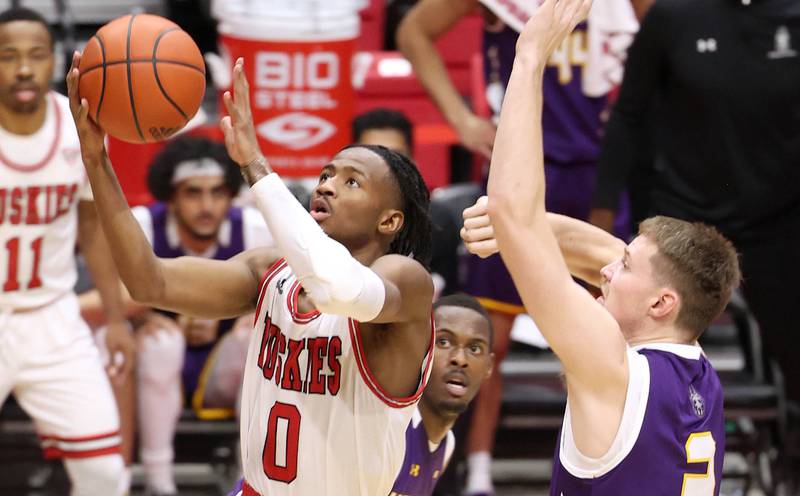 Northern Illinois Huskies guard Keshawn Williams gets to the basket ahead of Albany Great Danes forward Trey Hutcheson during their game Tuesday, Dec. 20, 2022, in the Convocation Center at NIU in DeKalb.