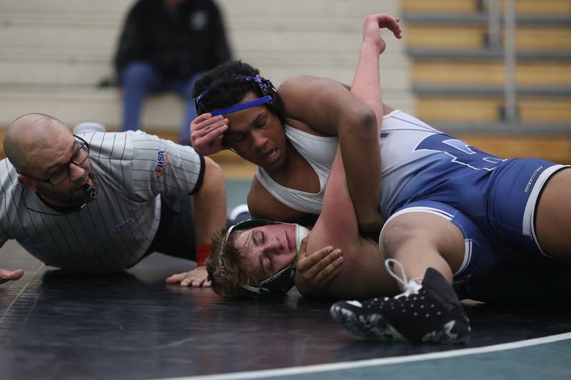 Plainfield South’s Julius Pierscionek works over Plainfield Central’s Michael Laudadio in the 190-pound match on Wednesday, Jan. 8, 2025.