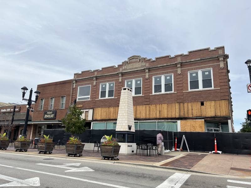 A cedar shaker awning has been removed from the former Sandberg building in downtown Wheaton.