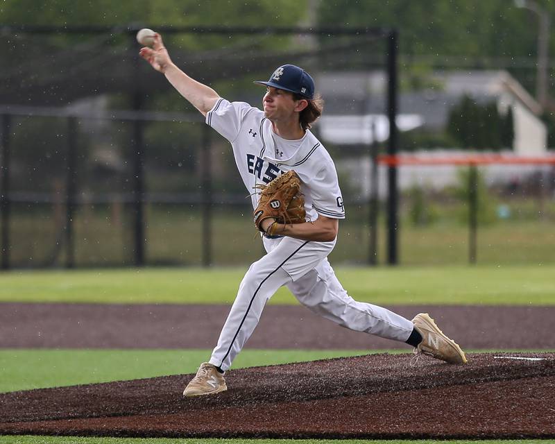 Oswego East's Patrick Flynn (12) delivers a pitch during Class 4A Romeoville Sectional semifinal between Oswego East at Downers Grove North.  May 31, 2023.